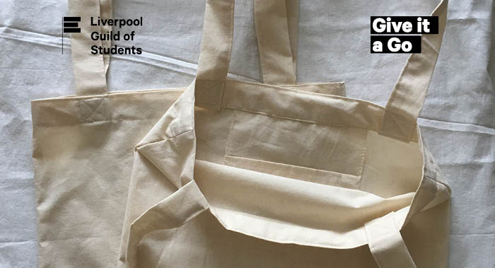Two plain cream tote bags rested on a white background 